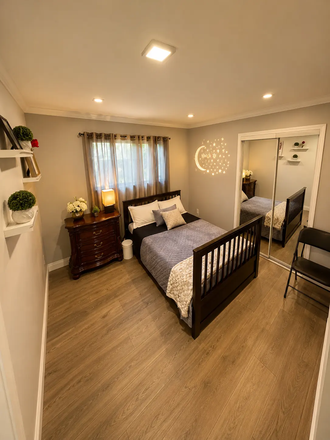 Cozy bedroom with a wood bed frame, warm lighting and mirrored closet doors