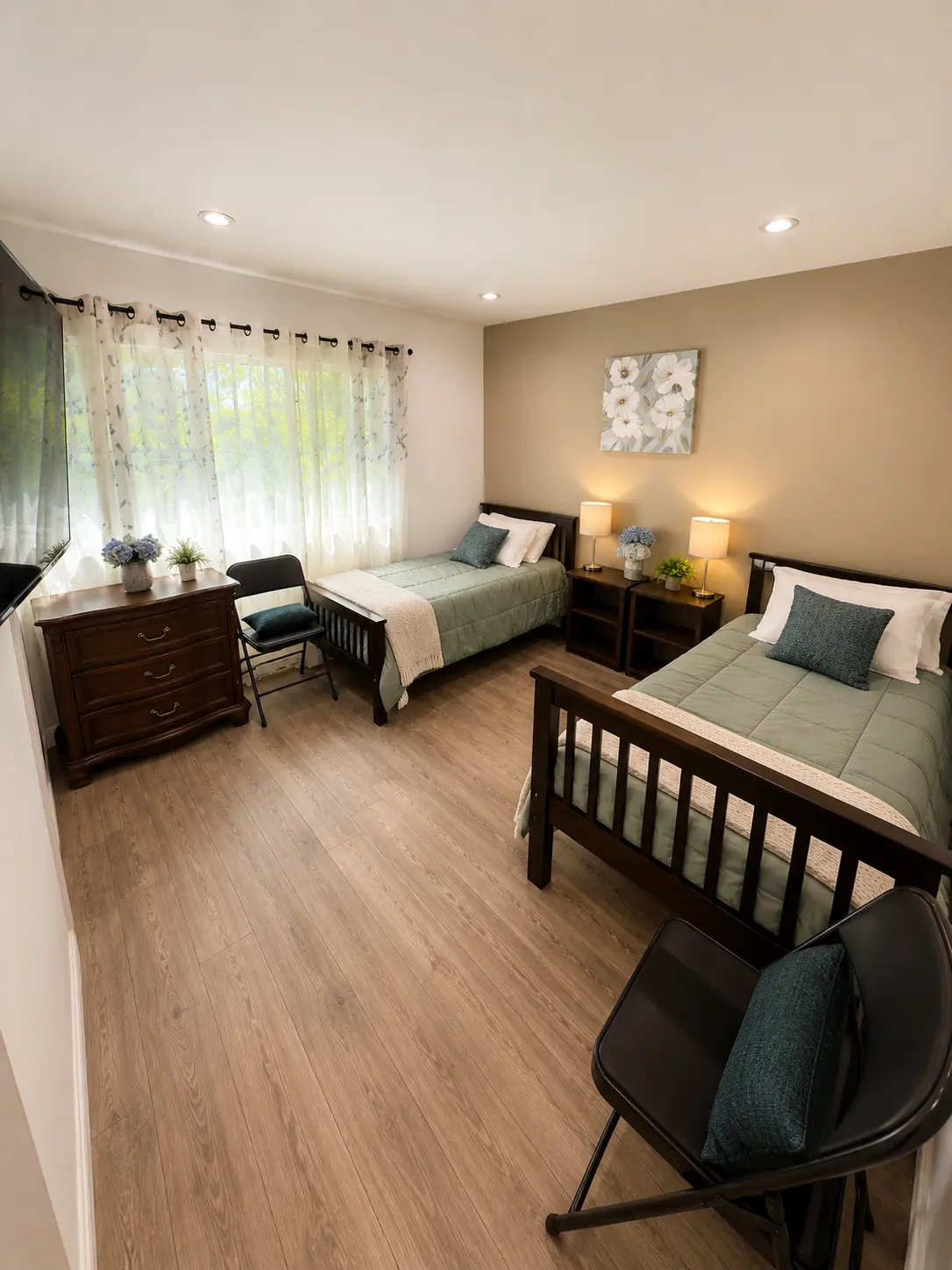 Shared bedroom with two single beds, wood frames and a large curtained window